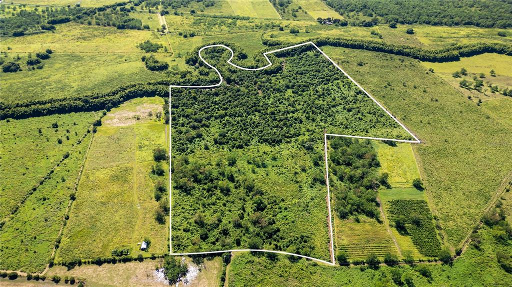 An aerial view shows a large, irregularly shaped plot of land outlined in white — 2 KM 162 BENAVENTE ROAD UNIT 255, HORMIGUEROS, PR
