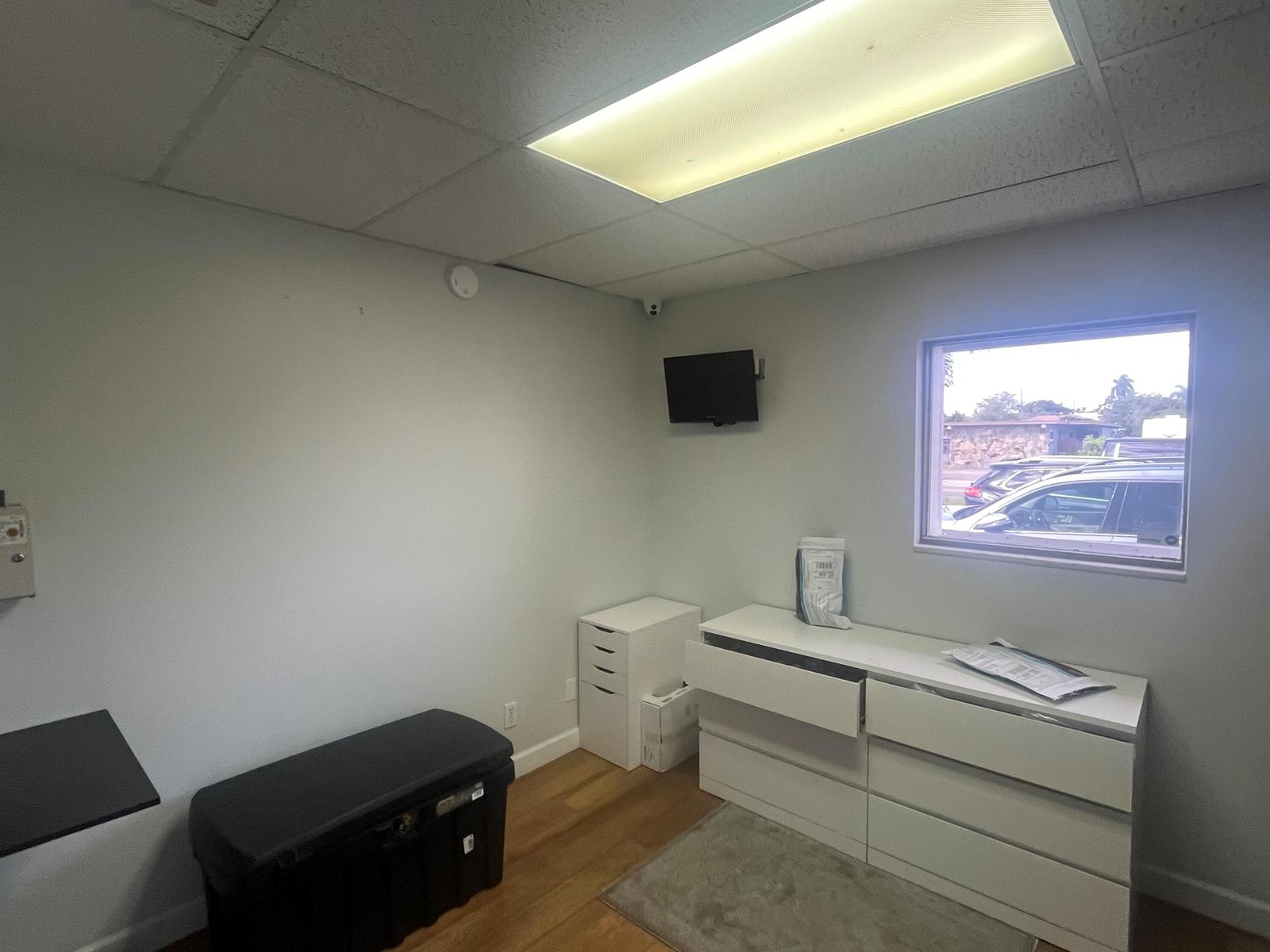 A small office room features white walls, a window, a dresser, and a storage chest — 1708 N Federal Highway, FL 33460, FL