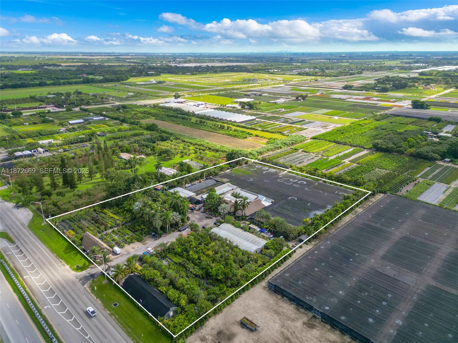 An aerial view shows a plant nursery with greenhouses and vegetation outlined in white — 20425 SW 177th av, Miami FL 33187, MIAMI, FL