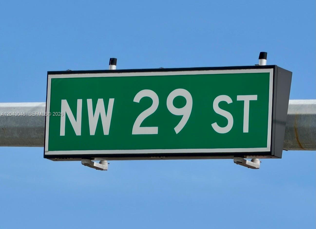 A green street sign reading NW 29 ST is mounted on a metal pole — 2899 NW 7th Ave, Miami FL 33127, MIAMI, FL