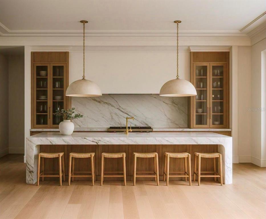 This is a rendering of a modern kitchen featuring a marble waterfall island and cabinetry — 40 PALMER AVENUE, WINTER PARK, FL