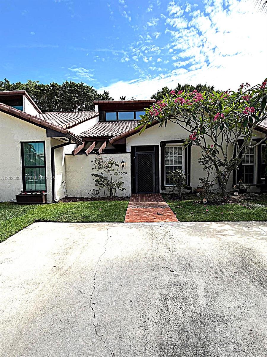 A single-story house with a tiled roof, white stucco exterior, and a brick walkway — 6620 Tiburon Cir # 3, Boca Raton FL 33433, BOCA RATON, FL