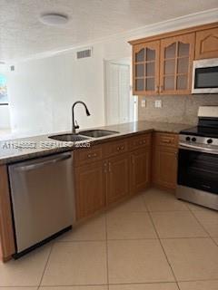 A kitchen features light wood cabinets, stainless steel appliances, and a tiled floor — 2950 SW 3rd Ave # 3A, Miami FL 33129, MIAMI, FL