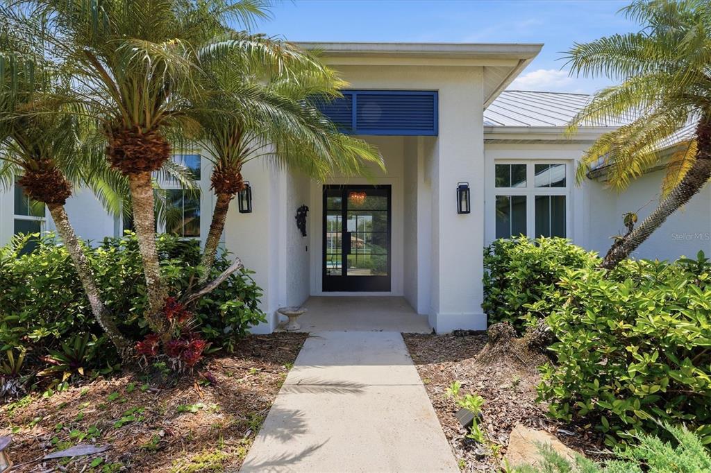 An aerial view shows a single-story house with a pool and a red location pin — 4575 SATINLEAF LANE, SARASOTA, FL