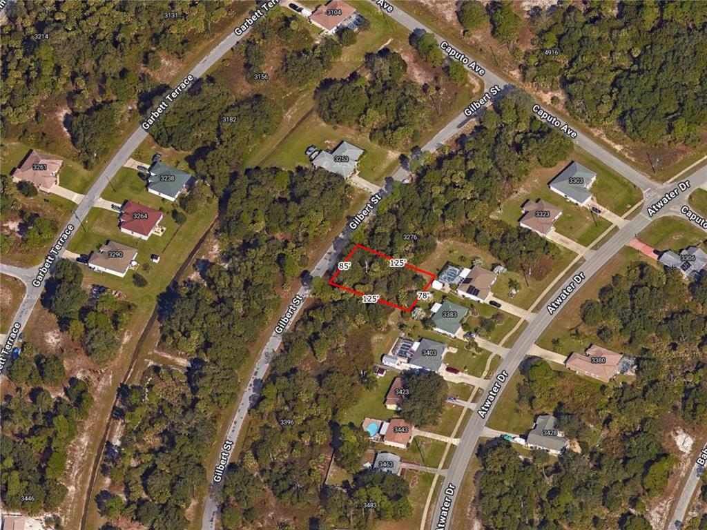 This is an aerial map showing a vacant lot outlined in red — GILBERT STREET, NORTH PORT, FL