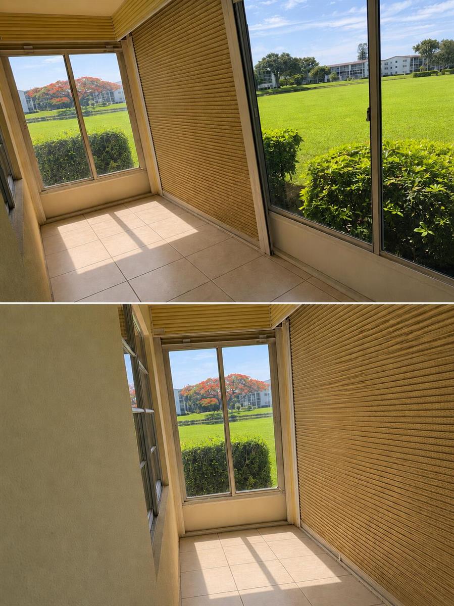 A sunroom with tile flooring, sliding glass doors, and a view of a grassy lawn — 305 Fanshaw H, Boca Raton FL 33434, BOCA RATON, FL
