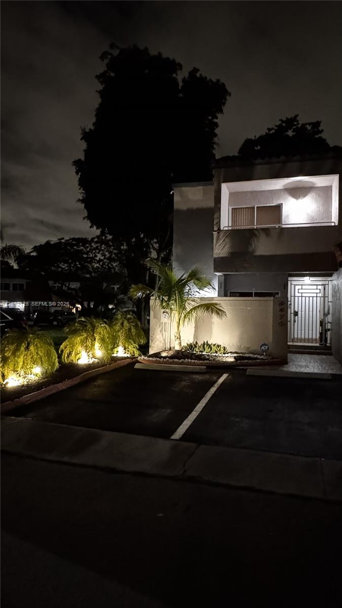A two-story stucco townhouse features a tiled roof, a private entrance, and two parking spaces — 6475 SW 129th Ave, Miami FL 33183, MIAMI, FL