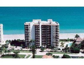 An aerial view of a high-rise condominium building located directly on a sandy beach — 800 Ocean Drive # 404, Juno Beach FL 33408, JUNO BEACH, FL