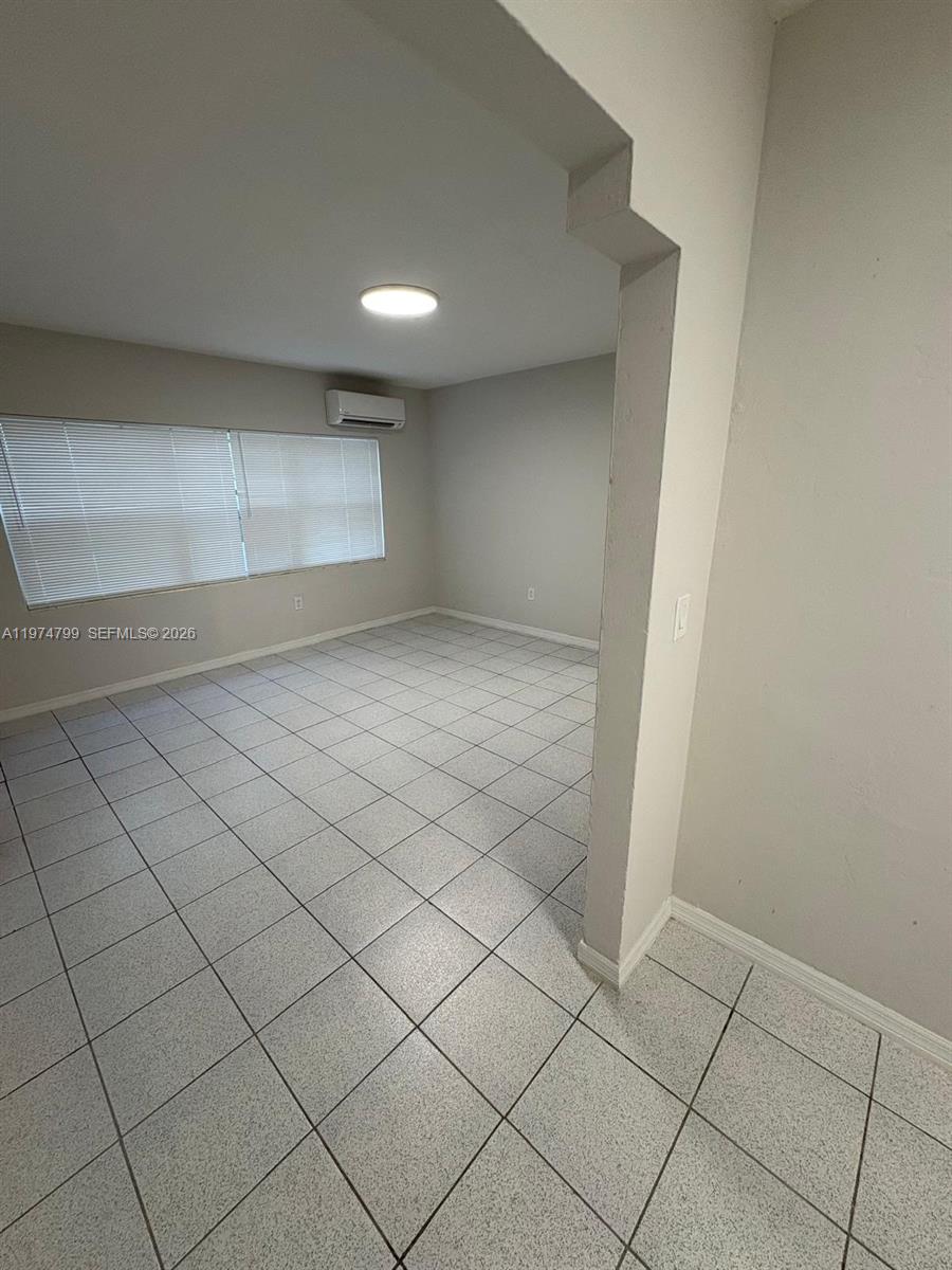 A room with white tiled floors, light-colored walls, and a window with blinds — 510 Santander Ave # 1, Coral Gables FL 33134, CORAL GABLES, FL