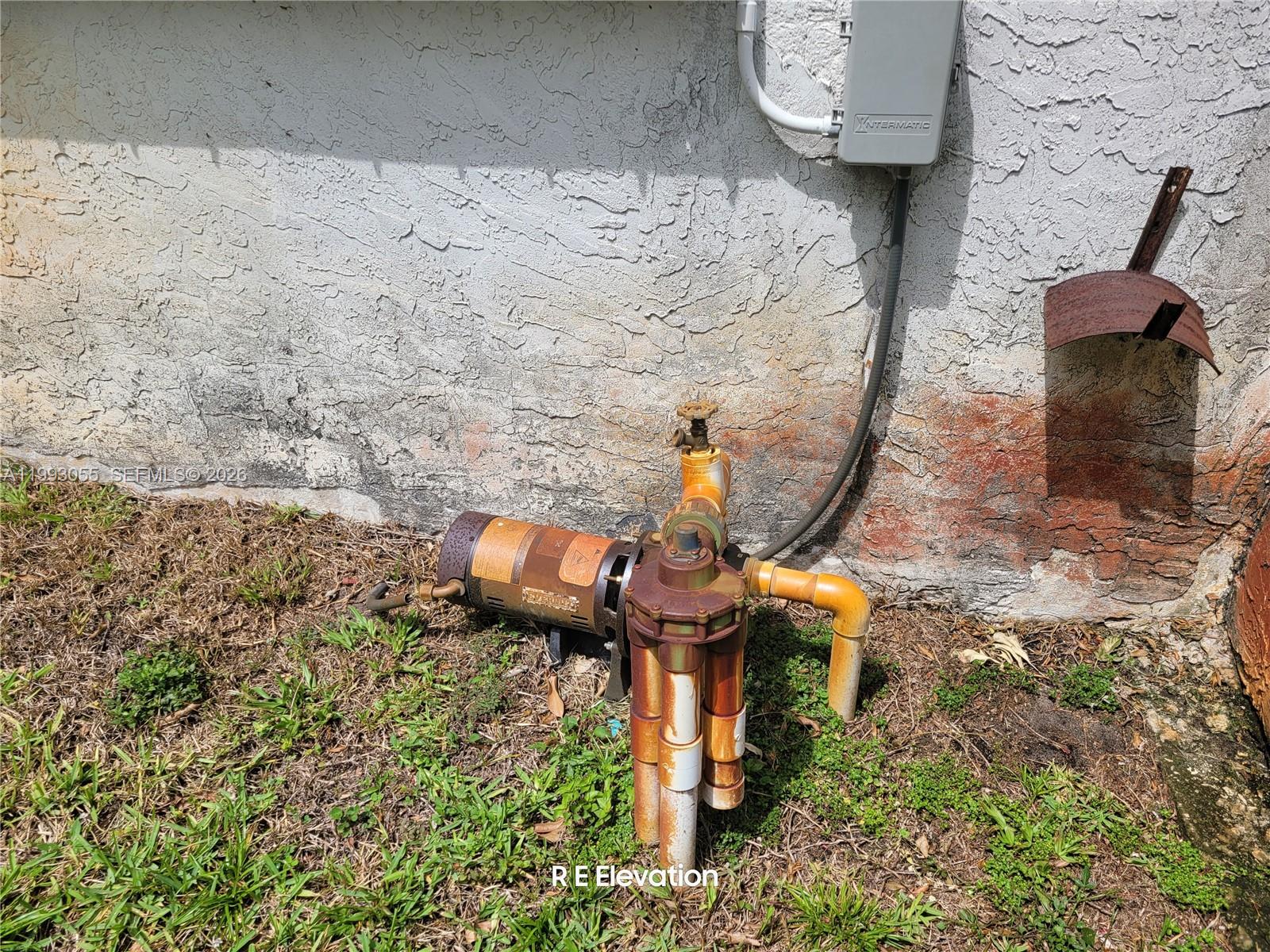 An outdoor pool pump and motor are installed against the exterior wall of a house — 1149 NW 45th Ave, Lauderhill FL 33313, LAUDERHILL, FL