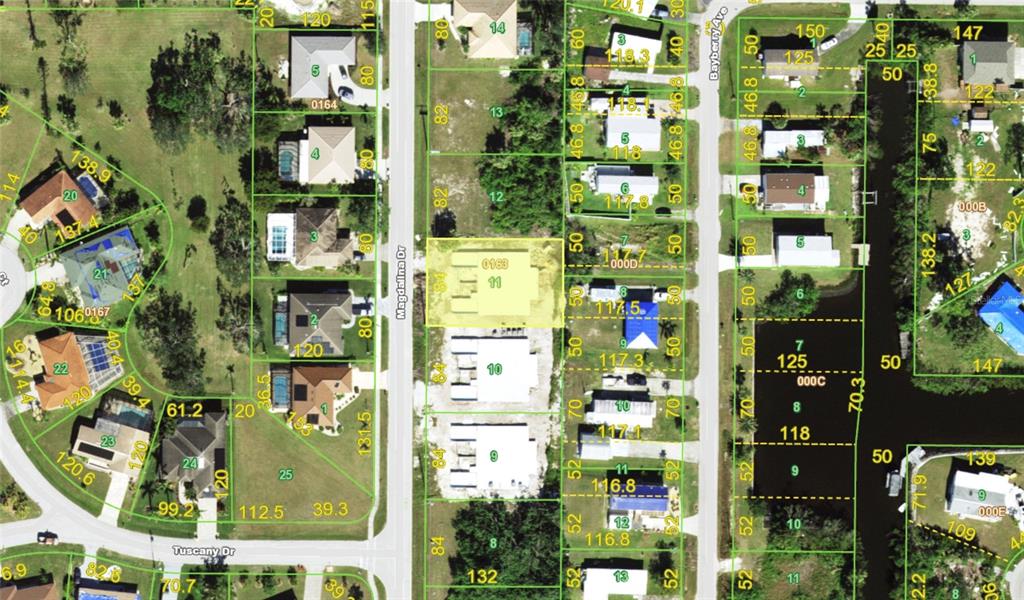 This is a satellite map view showing residential property lots and street layouts — 2926 MAGDALINA DRIVE, PUNTA GORDA, FL