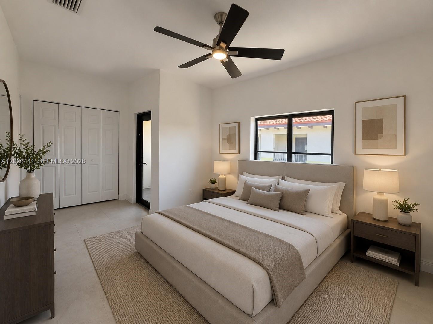 A modern bedroom features a queen bed, two nightstands, a ceiling fan, and a closet — 3204 Bird Ave # 104, Miami FL 33133, MIAMI, FL