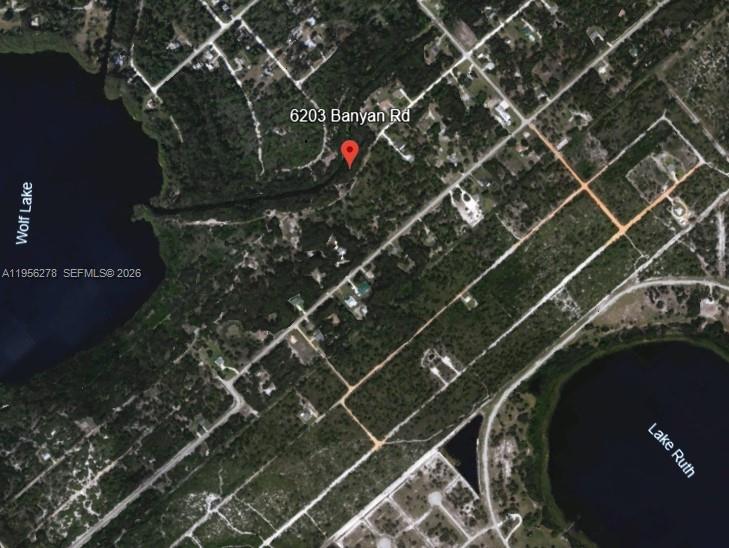 This is an aerial map view showing a property location between two lakes — 6203 BANYAN RD, Sebring FL 33875, SEBRING, FL