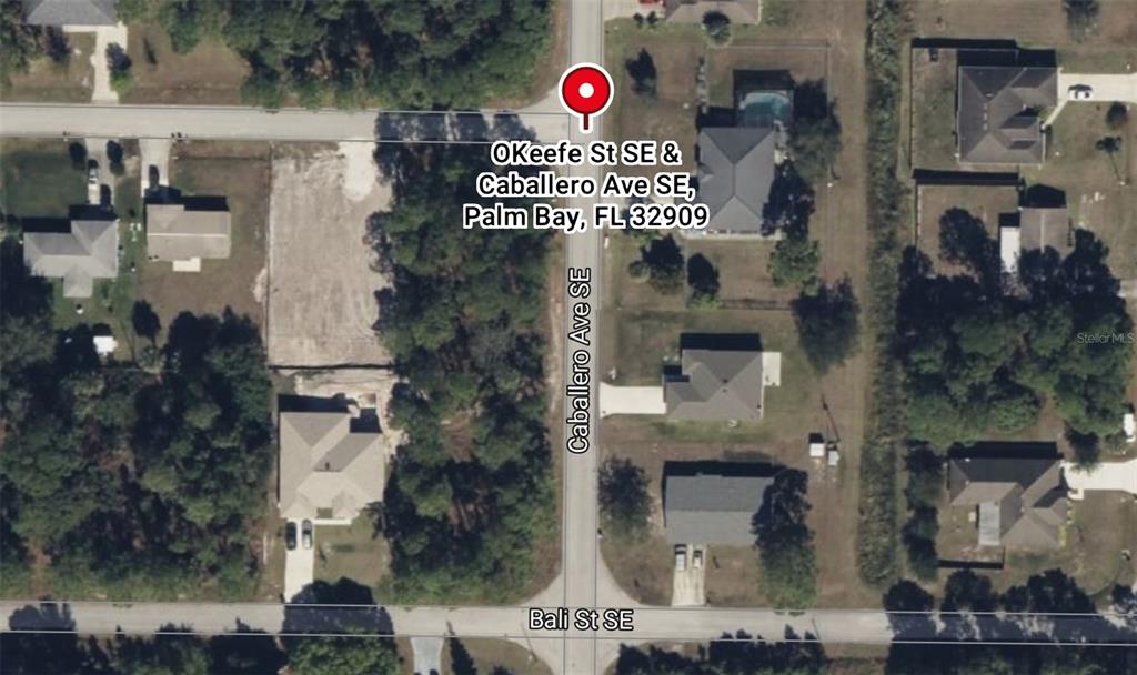 This is an aerial map view of a residential street intersection in Palm Bay, Florida — Lot 12 OKEEFE ST. SE & CABALLERO AVE SE, PALM BAY, FL