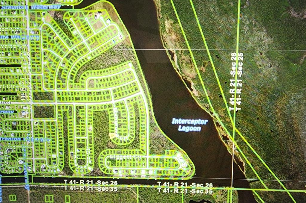 This is an aerial map showing a residential neighborhood bordering the Interceptor Lagoon — 10638 MANGROVE CIRCLE, PORT CHARLOTTE, FL