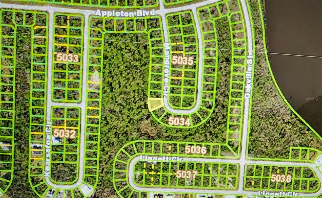 This is a satellite map showing residential lot layouts and street names in a neighborhood — 10638 MANGROVE CIRCLE, PORT CHARLOTTE, FL