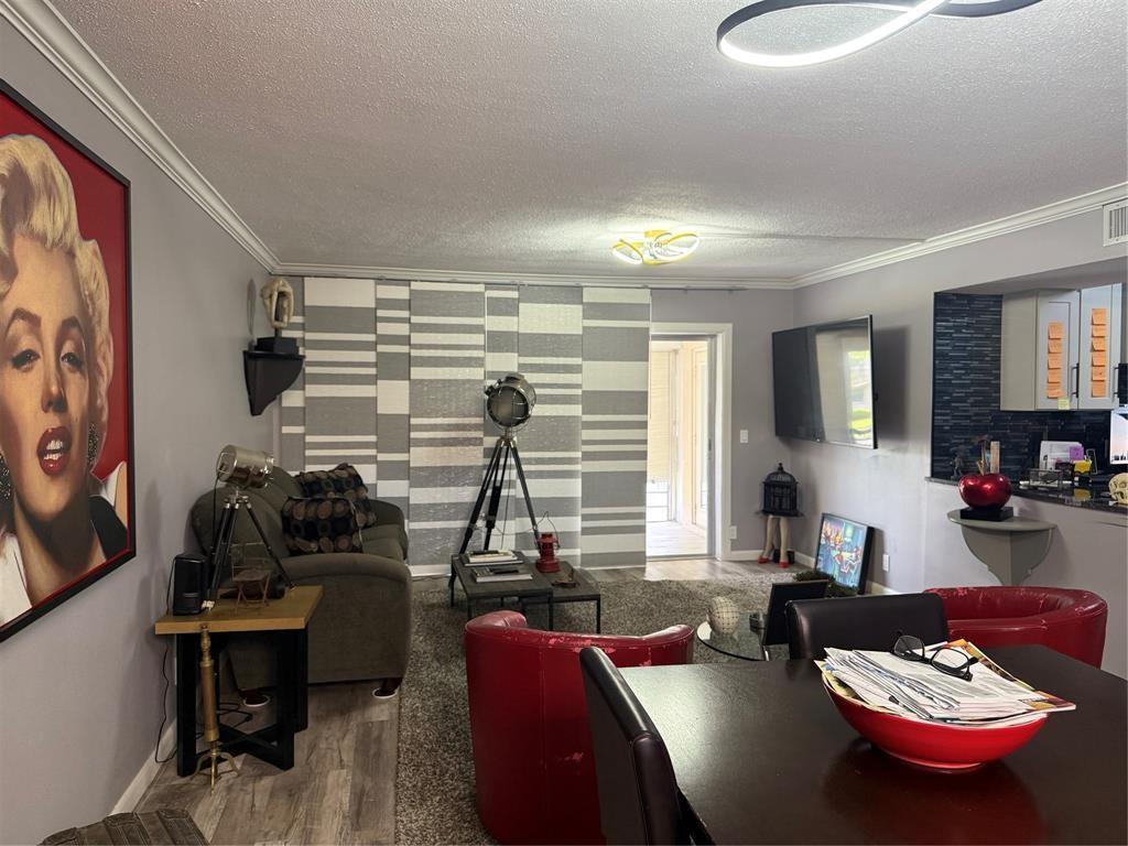 A living room features gray walls, a Marilyn Monroe portrait, and a sliding panel window treatment — 25 SE 13th Street # B2, Boca Raton FL 33432, BOCA RATON, FL