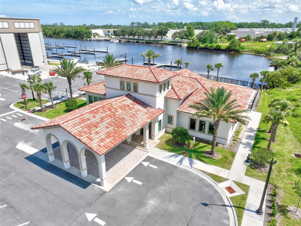 An aerial view of a Mediterranean-style building with a tile roof and a covered entrance — 2 MENORCA WAY, PALM COAST, FL
