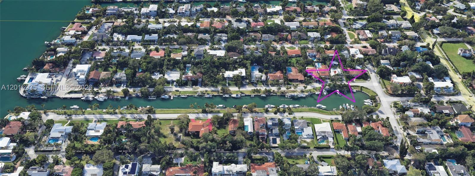 This aerial view shows a waterfront residential neighborhood with a canal and a highlighted property — 1082 NE 89th St, Miami FL 33138, MIAMI, FL