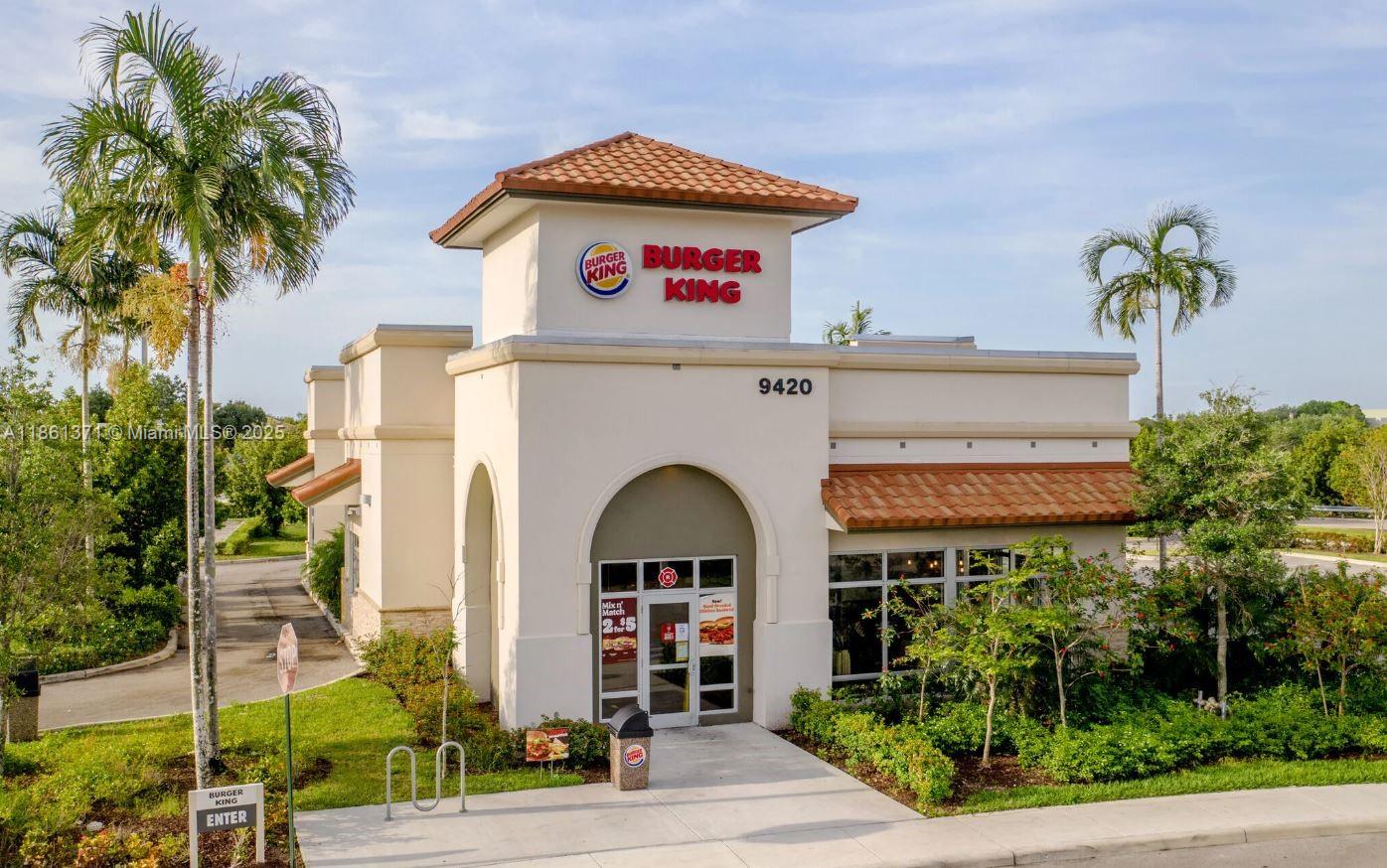 An exterior view of a Burger King restaurant building with a tiled roof and landscaping — 9440 W Commercial Blvd, Sunrise FL 33351, SUNRISE, FL