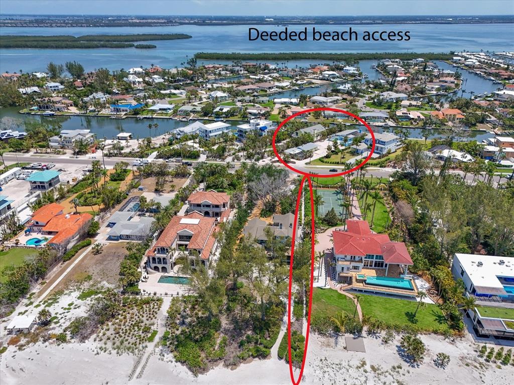 An aerial view shows a coastal neighborhood with a red-circled area and beach access path — 5920 GULF OF MEXICO DRIVE, LONGBOAT KEY, FL