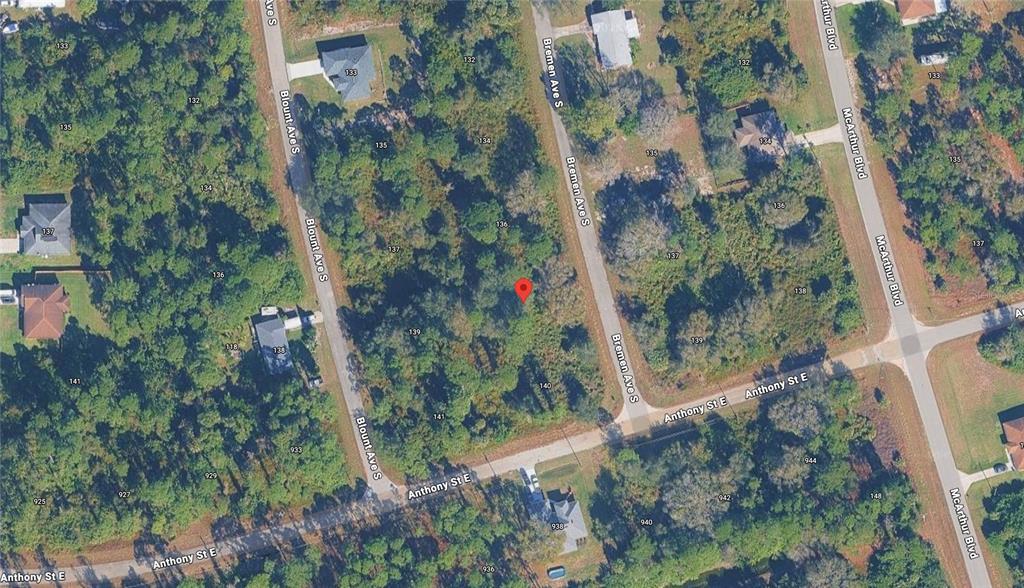 This is an aerial map view of a vacant, wooded residential lot — 138 BREMEN AVENUE S, LEHIGH ACRES, FL