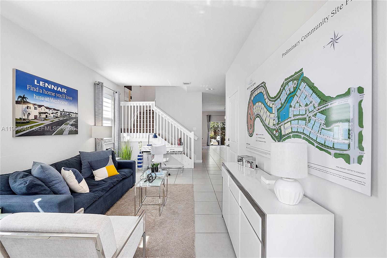 A living room features a blue sofa, a white console table, and a community site map — 2361 NW 125th St, Miami FL 33167, MIAMI, FL