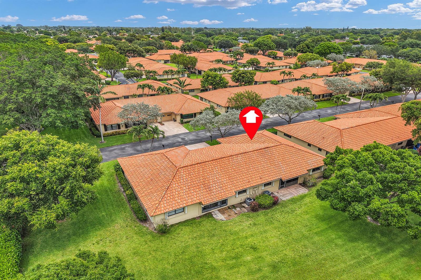 An aerial view of a single-story residential building with a terracotta tile roof and lawn — 4450 Nutmeg Tree Lane # A, Boynton Beach FL 33436, BOYNTON BEACH, FL