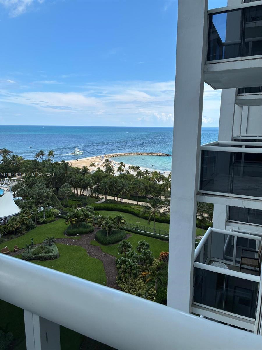 An elevated view shows a lush green park, a sandy beach, and the ocean — 10275 Collins Ave # 1004, Bal Harbour FL 33154, BAL HARBOUR, FL
