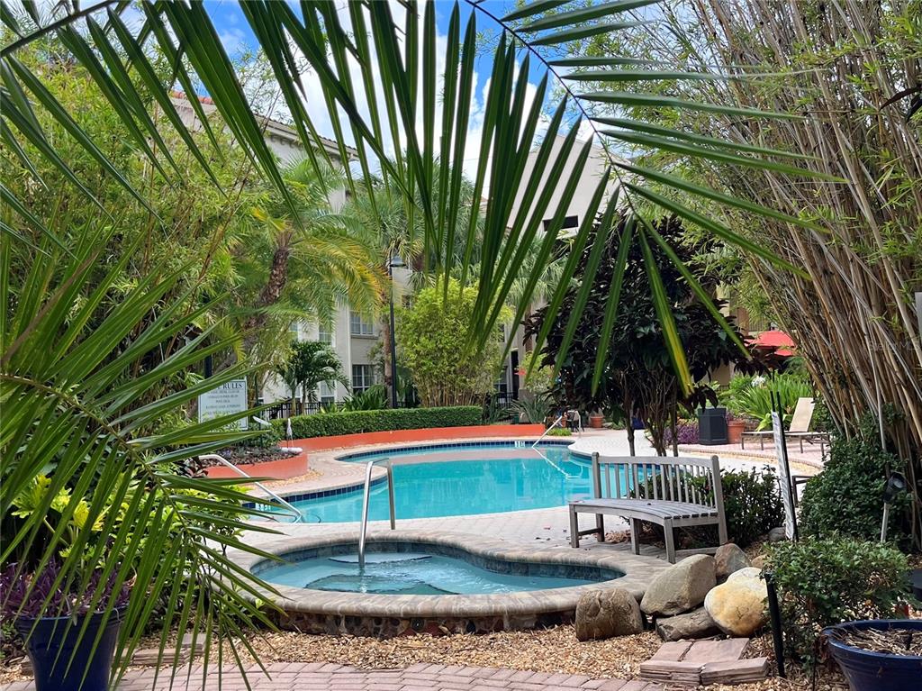An outdoor patio features a sofa, two chairs, and a coffee table under a gazebo — 501 S MOODY AVENUE UNIT 1119B, TAMPA, FL