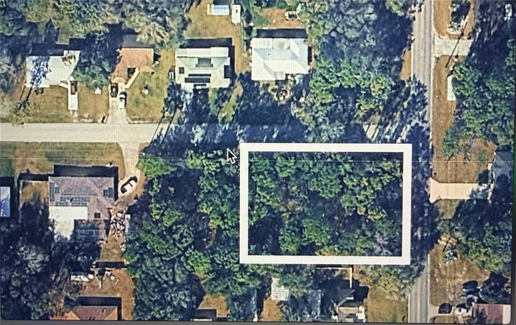 An aerial view shows a rectangular, wooded vacant lot surrounded by residential houses and streets — 6280 E KING LANE, INVERNESS, FL