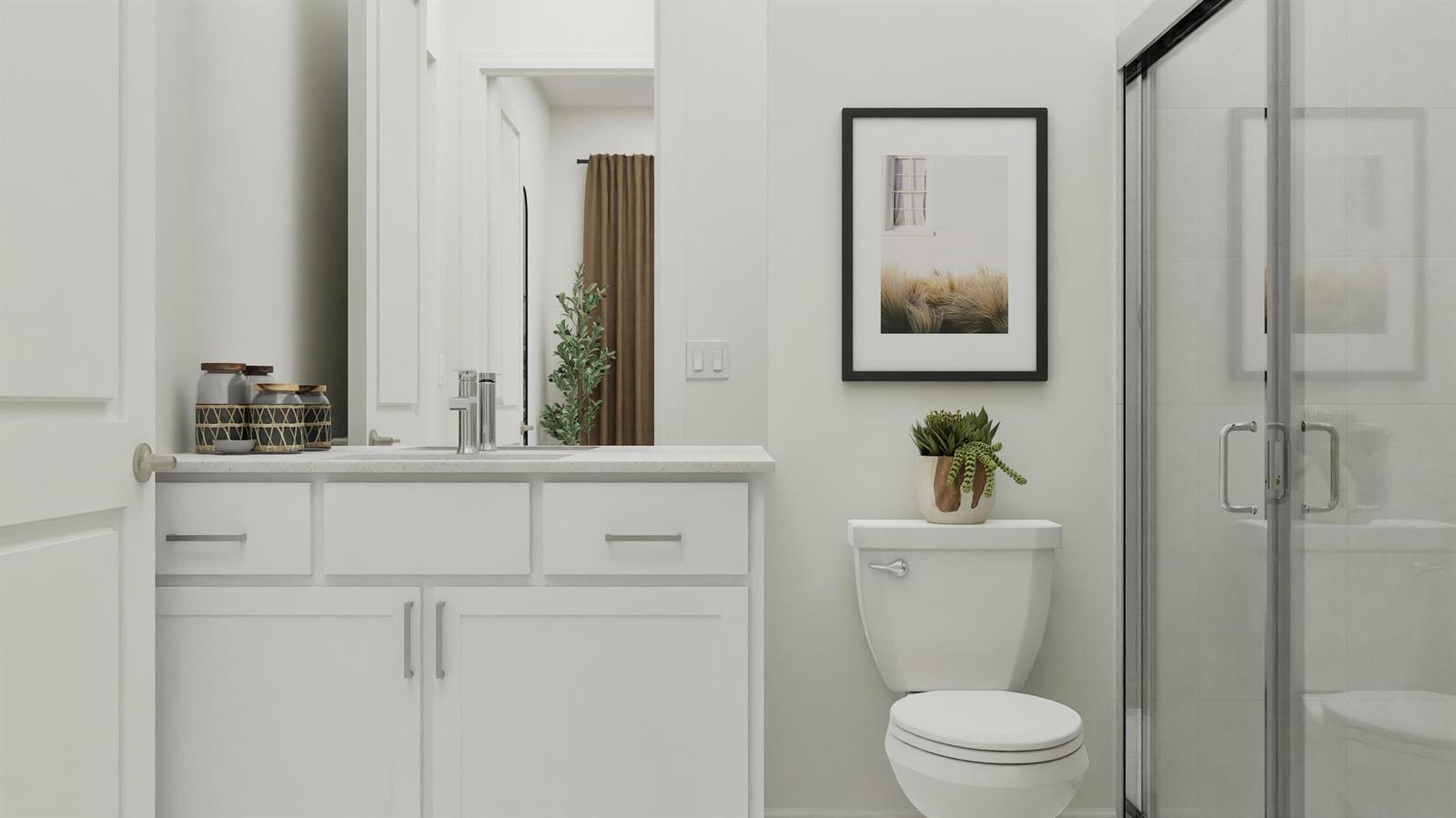 This bathroom features a white vanity, a toilet, and a glass-enclosed shower — 1014 Raleigh Way, Wellington FL 33414, WELLINGTON, FL