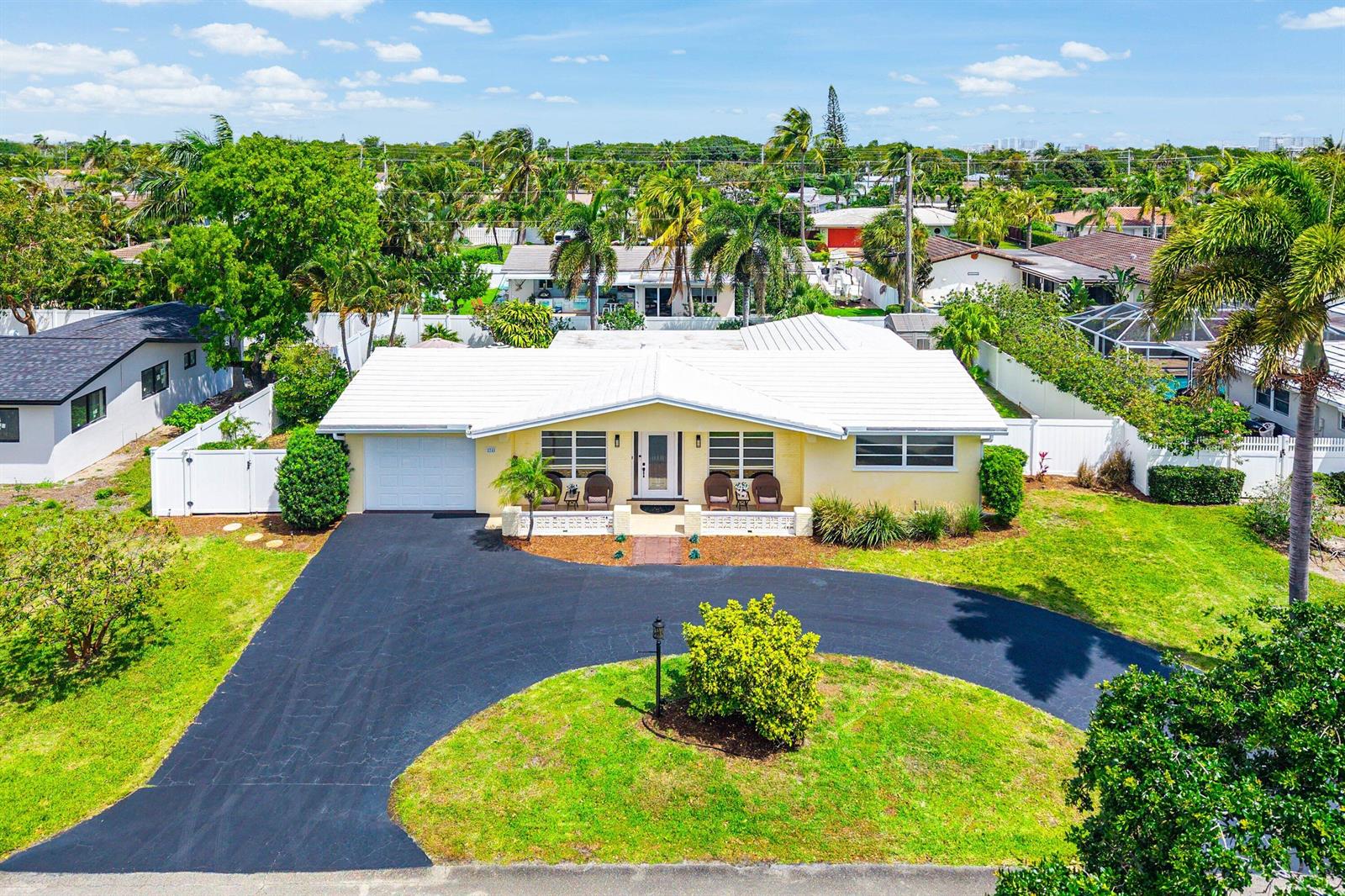 An aerial view shows a yellow single-story house with a white roof and circular driveway — 2741 NE 52nd Street, Lighthouse Point FL 33064, LIGHTHOUSE POINT, FL