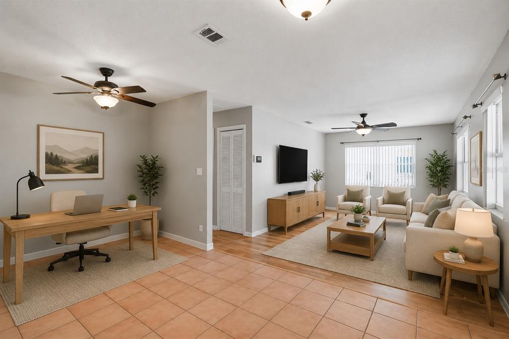 An open-concept room features a home office area and a living room with tile flooring — 4307 W WISCONSIN COURT, TAMPA, FL