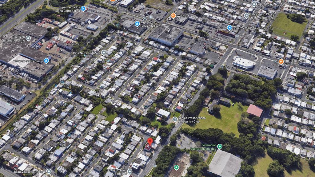 This is an aerial satellite view of a residential neighborhood with a marked property — 5 Calle 519 QB6 URBANIZACIÓN COUNTRY CLUB, CAROLINA, PR