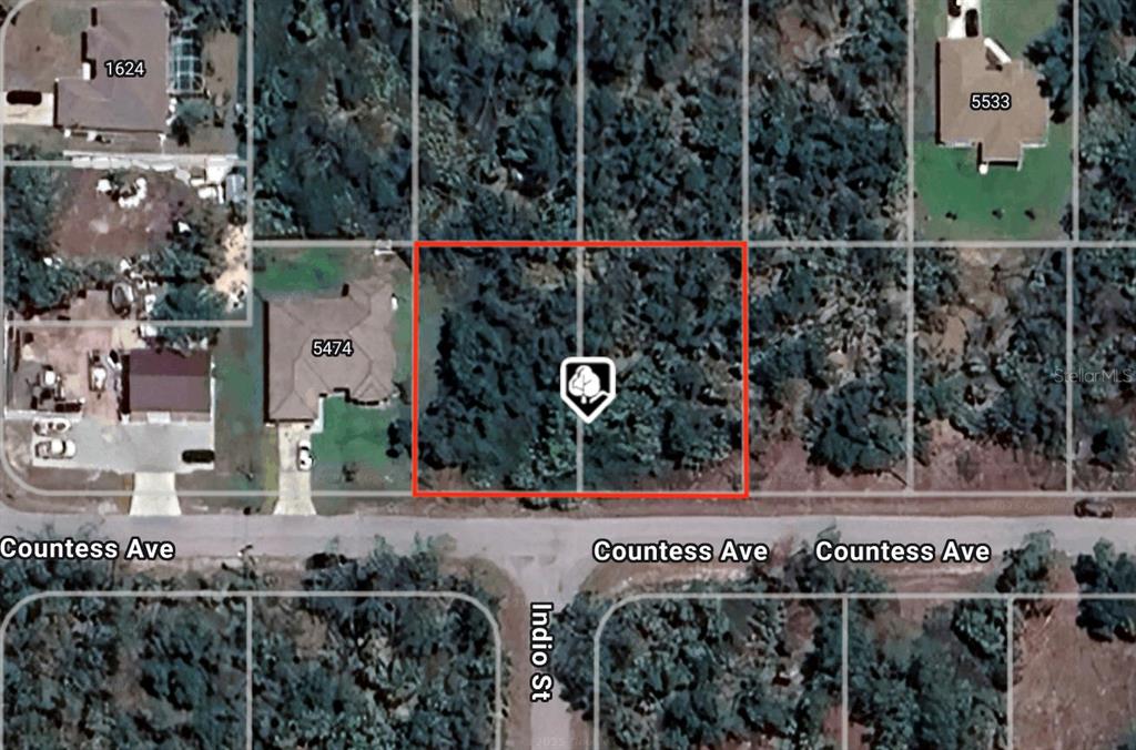 This is an aerial map view showing a vacant, wooded residential lot outlined in red — Lot 5 & 6 COUNTESS AVENUE, NORTH PORT, FL