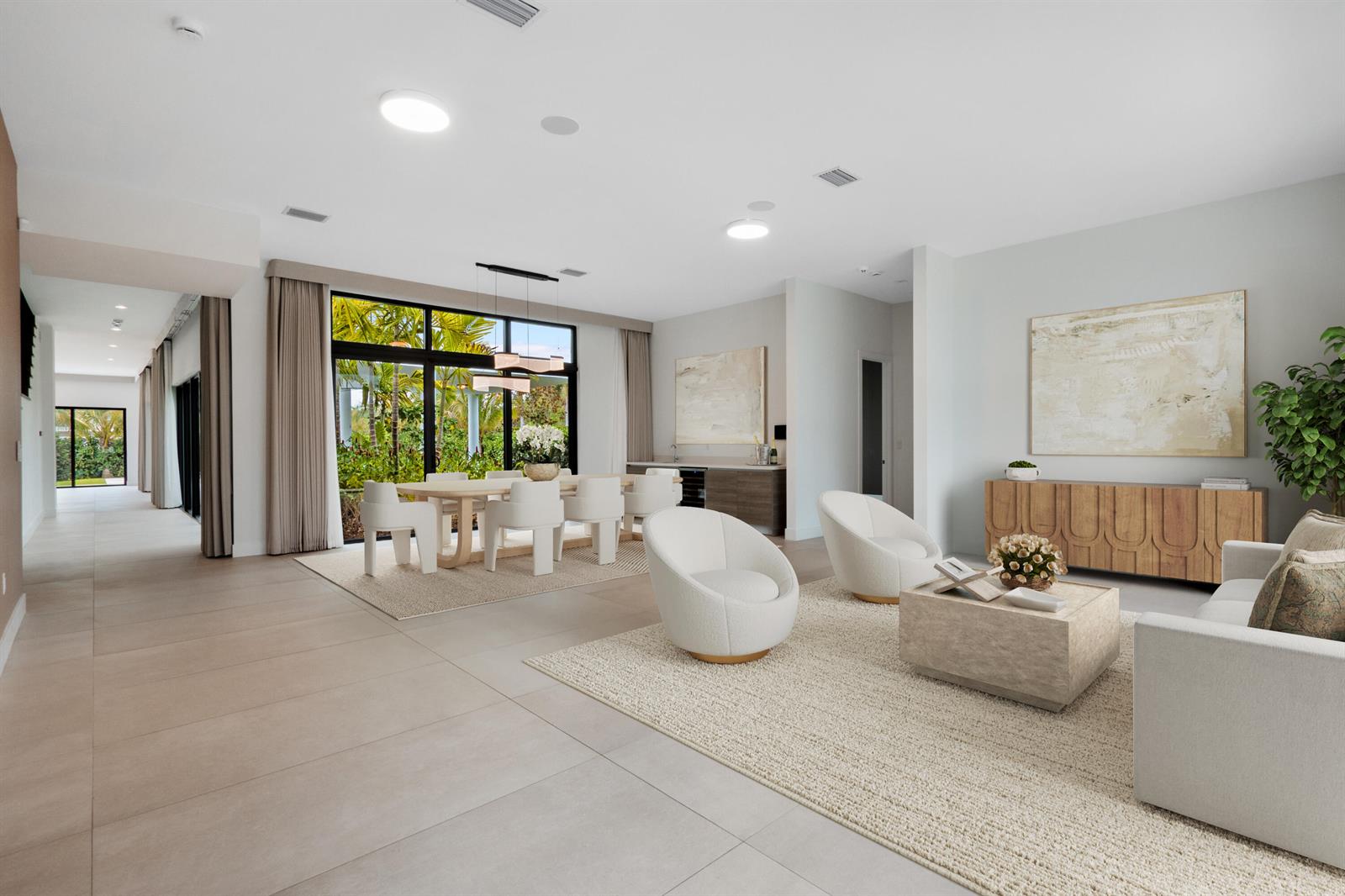 A bright, open-concept living and dining area features neutral furniture, tile flooring, and large windows — 16788 Natures Way, Weston FL 33326, WESTON, FL
