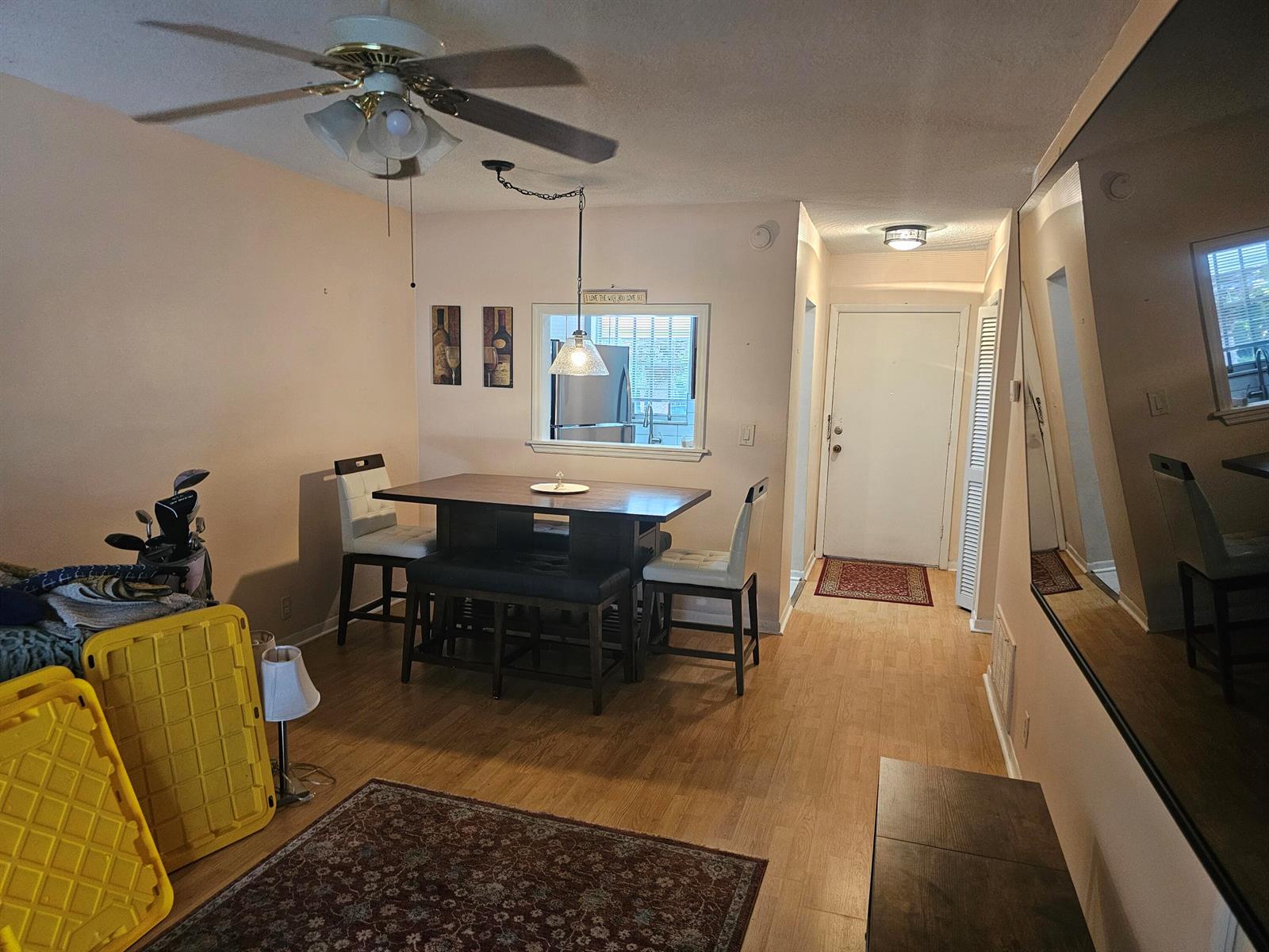 A dining area with a table, chairs, a ceiling fan, and a view of the entryway — 2475 W Golf Boulevard # 243, Pompano Beach FL 33064, POMPANO BEACH, FL