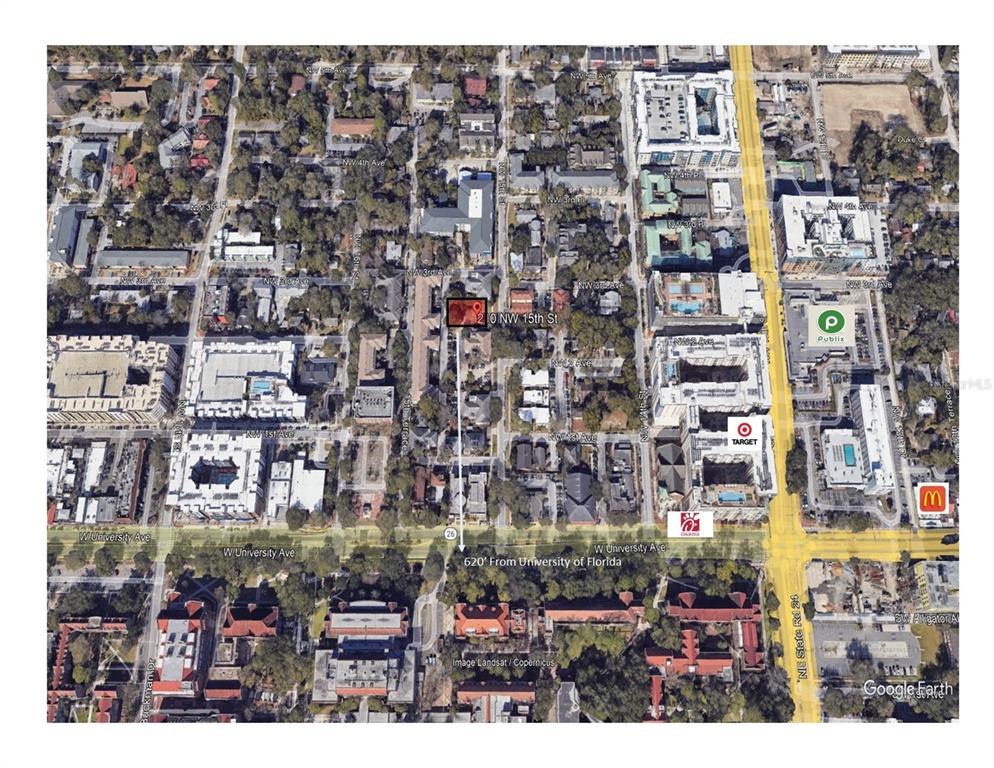 This is an aerial map showing a property location near the University of Florida campus — 210 NW 15TH STREET, GAINESVILLE, FL