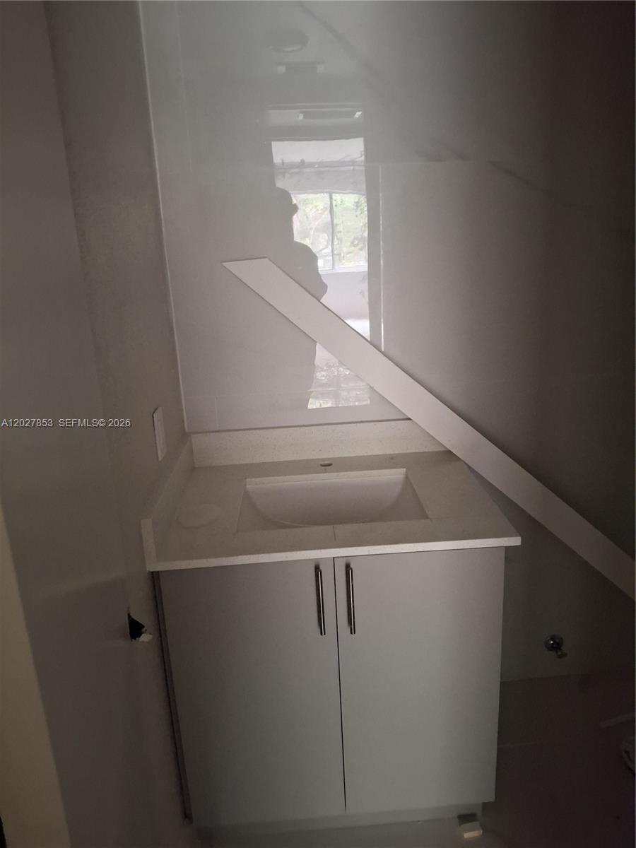 A bathroom vanity with a light gray cabinet and a white countertop is under construction — 13480 NE 6th Ave # 207, North Miami FL 33161, NORTH MIAMI, FL