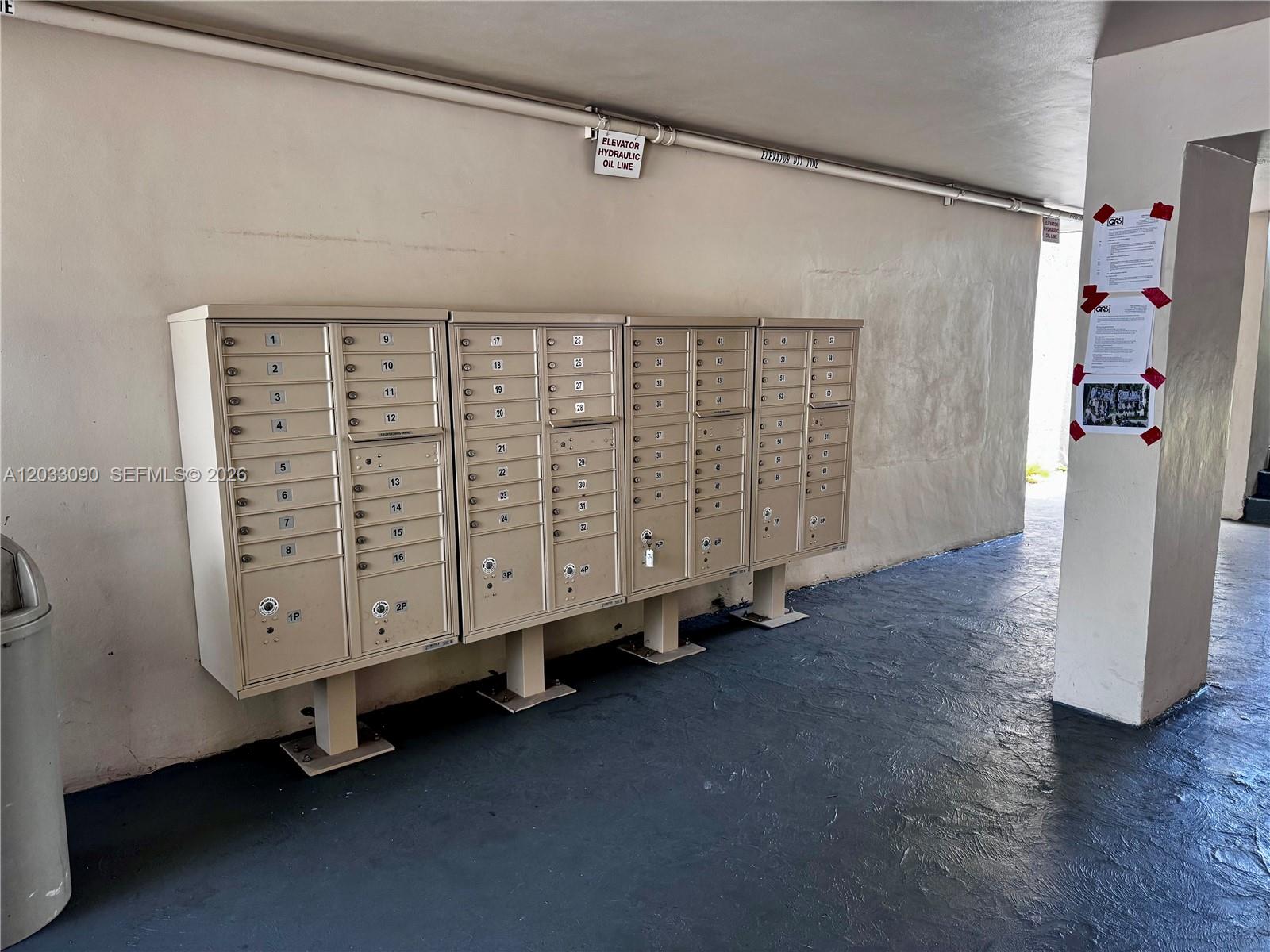 A row of metal mailboxes is mounted on a wall in a covered outdoor area — 1121 SW 122nd Ave # 2, Miami FL 33184, MIAMI, FL