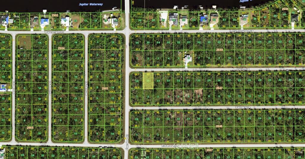 This is an aerial map showing a grid of residential land plots and streets — 14007 LUXO AVENUE, PORT CHARLOTTE, FL