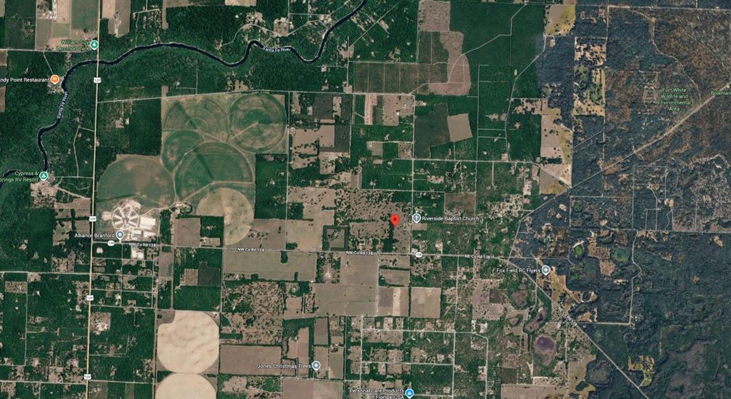 This is an aerial map view of a rural area with farmland and forest — OFF NW CR 138 Lot 71, BRANFORD, FL