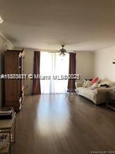 A living room features light wood-look flooring, a ceiling fan, and a beige sofa — 3606 S Ocean Blvd # 504, Highland Beach FL 33487, HIGHLAND BEACH, FL