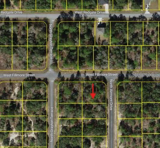 This is an aerial map showing a vacant residential lot marked with a red arrow — 6714 N AIRMONT DRIVE, DUNNELLON, FL