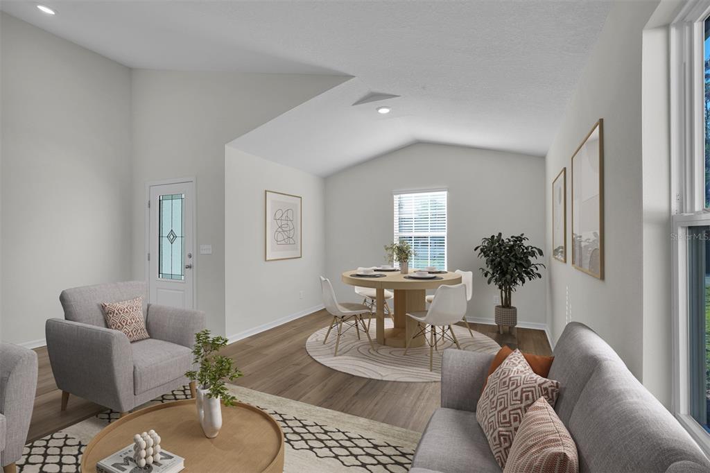 This is a digital rendering of a living and dining area with light wood-look flooring — 5251 SW 164TH STREET ROAD, OCALA, FL