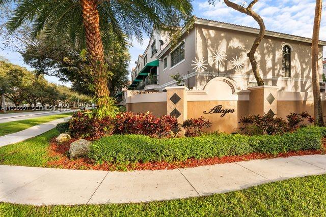 A multi-story apartment building with a sign reading Allegro stands behind a landscaped garden — 12691 NW 14th Pl, Sunrise FL 33323, SUNRISE, FL