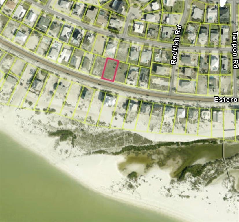 This is an aerial map showing a vacant lot highlighted in pink near a beach — 8033 ESTERO BOULEVARD, FORT MYERS BEACH, FL