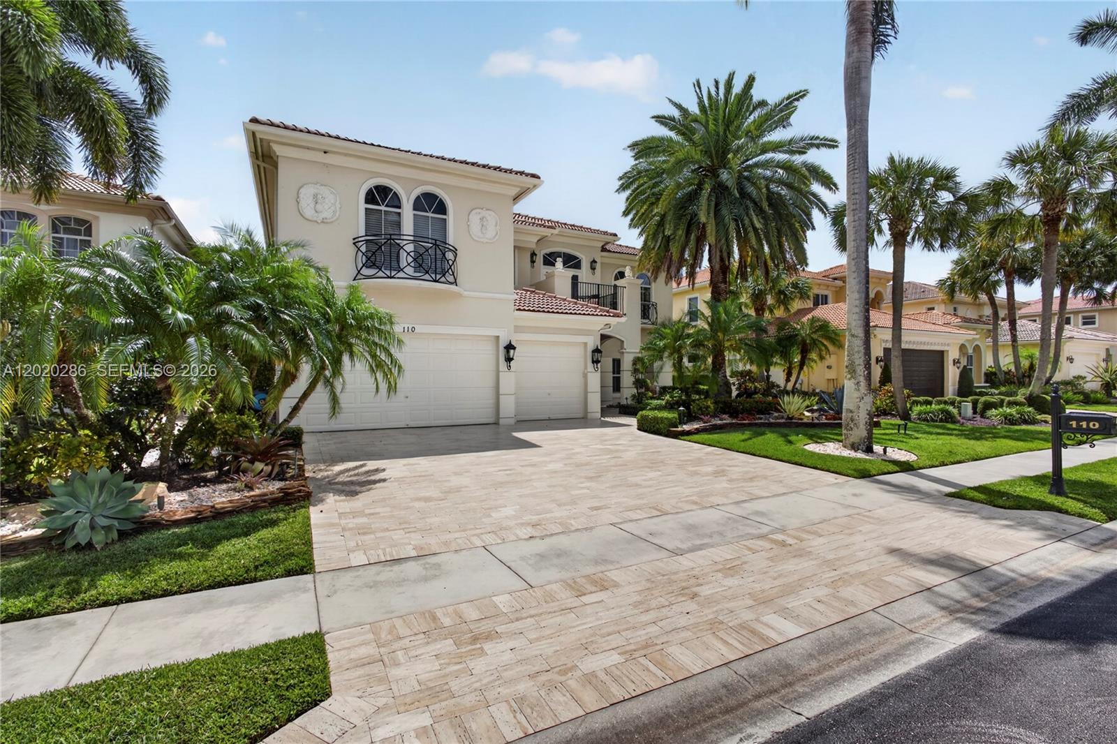 A two-story stucco house features a paved driveway, a three-car garage, and palm trees — 110 Abondance Dr, Palm Beach Gardens FL 33410, PALM BEACH GARDENS, FL