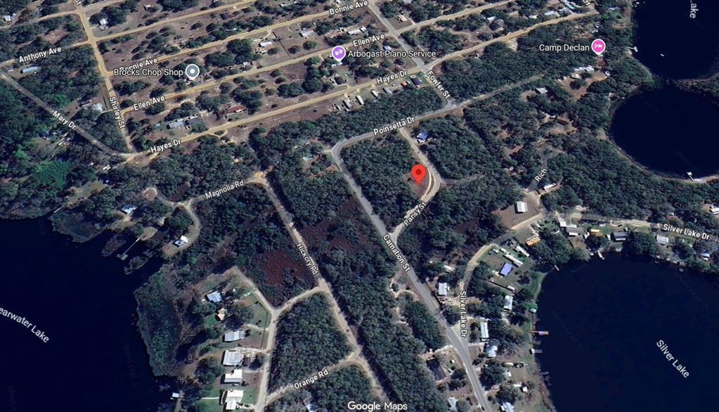 This is a satellite map view of a residential area near two lakes — 106 OLEANDER DR, INTERLACHEN, FL
